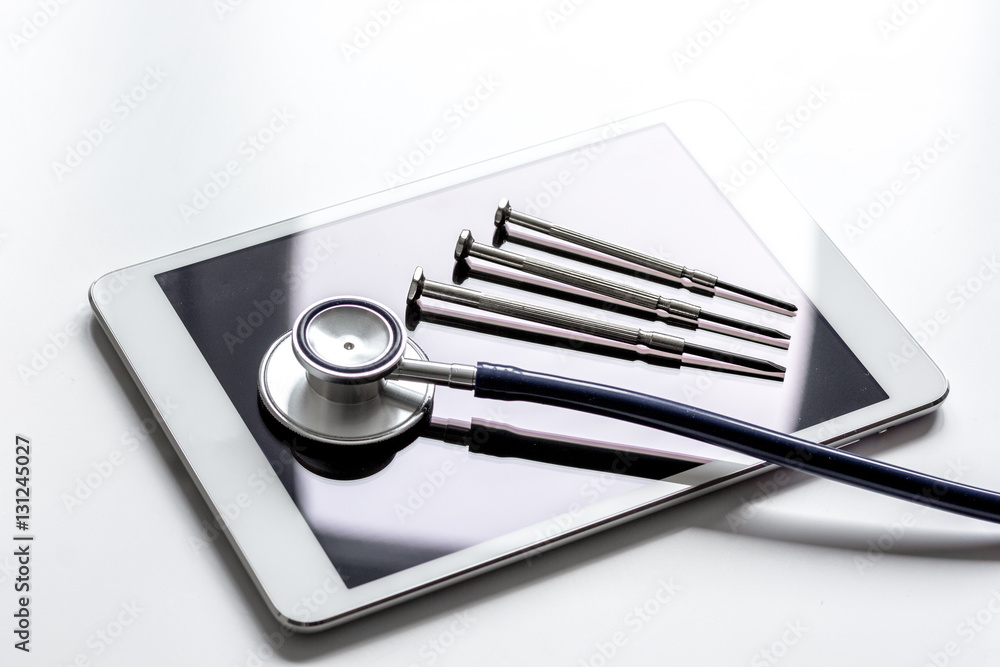 diagnostic of gadgets on white background with stethoscope