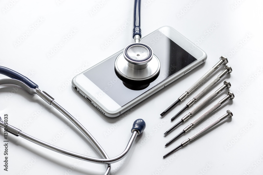 diagnostic of gadgets on white background with stethoscope