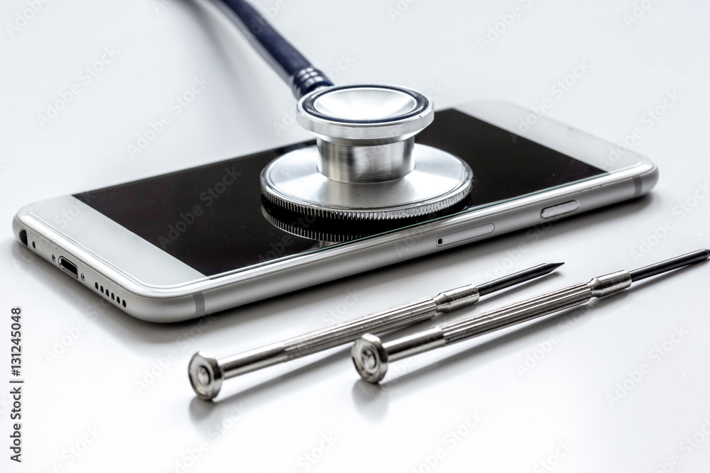 diagnostic of gadgets on white background with stethoscope