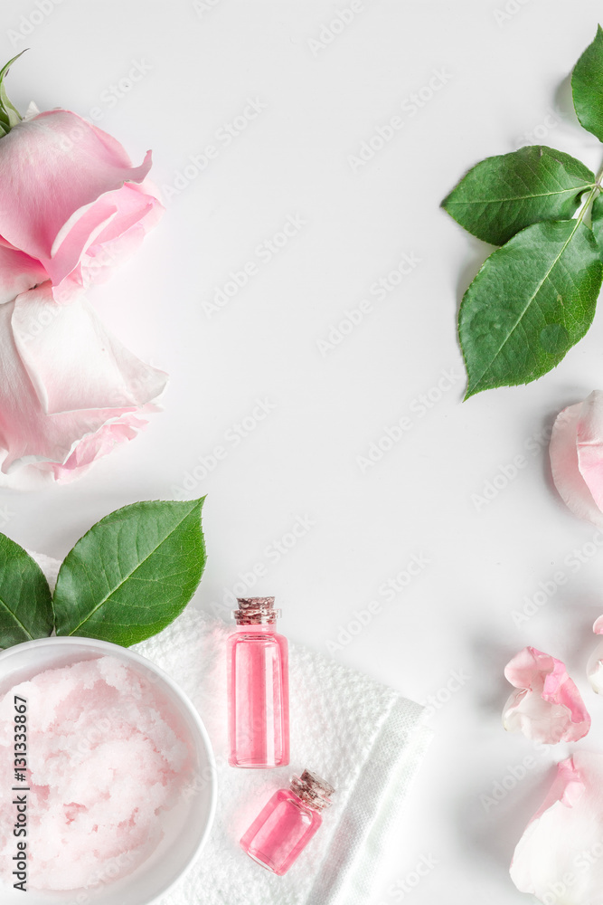 organic cosmetic with rose oil on white background top view