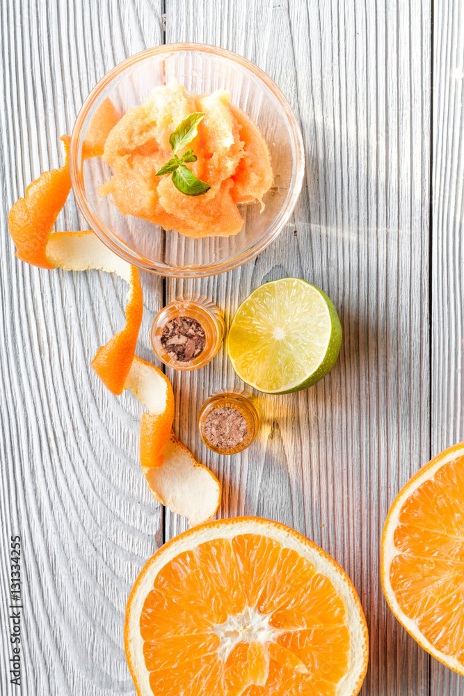 organic cosmetic with citrus on wooden background top view