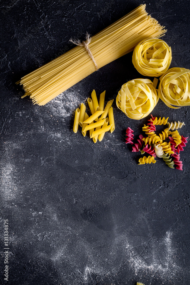 various kinds of paste on dark background top view