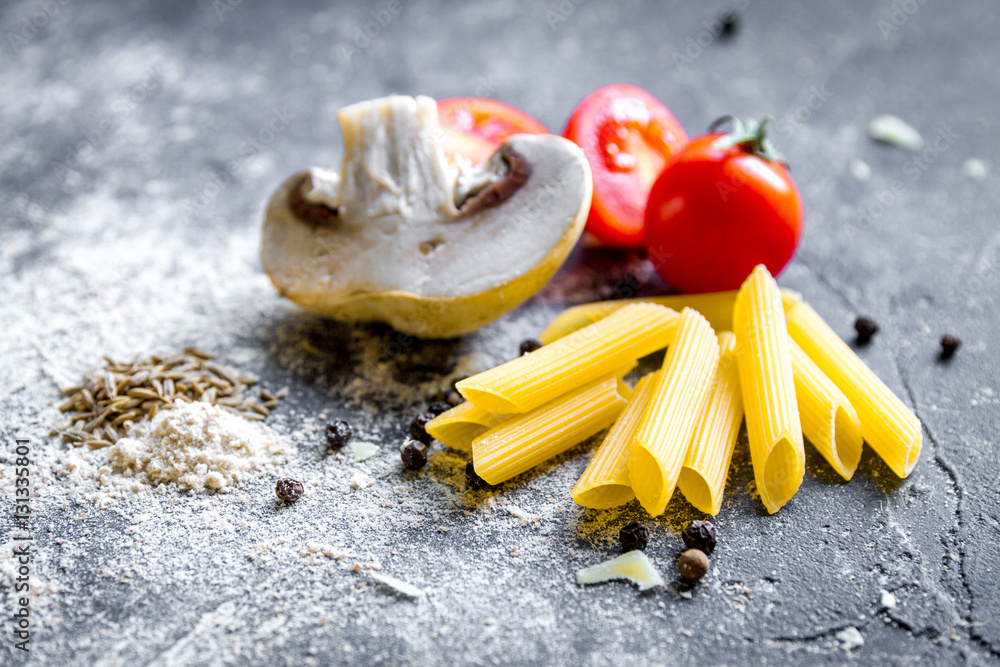 ingredients for cooking paste on dark background close up