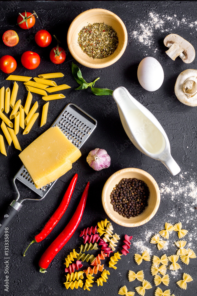 ingredients for cooking paste on dark background top view