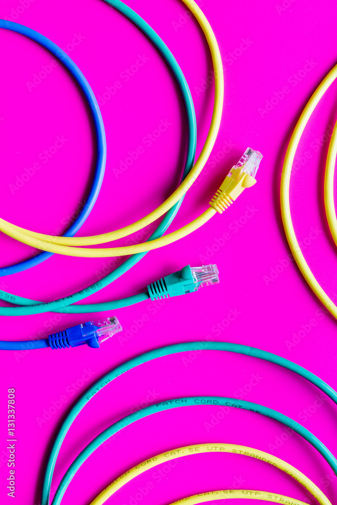 concept network internet cable on pink background close up