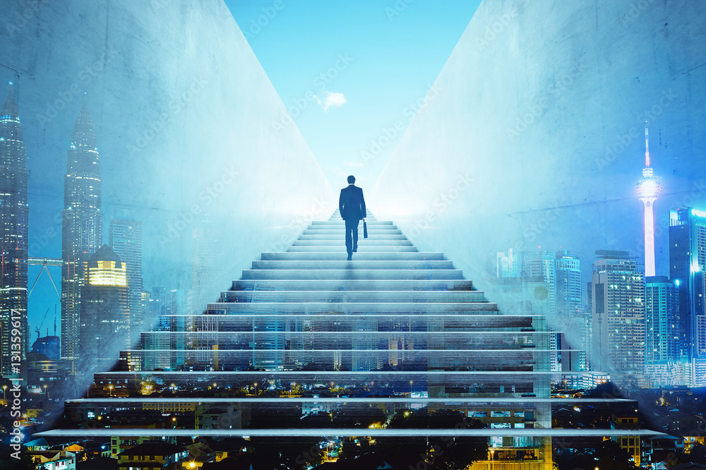 Rear view of a businessman climbing stairs to get to a large city center. Concept of success and app