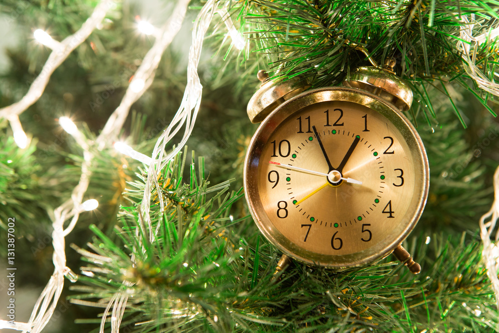 Christmas tree with lights on the wooden background