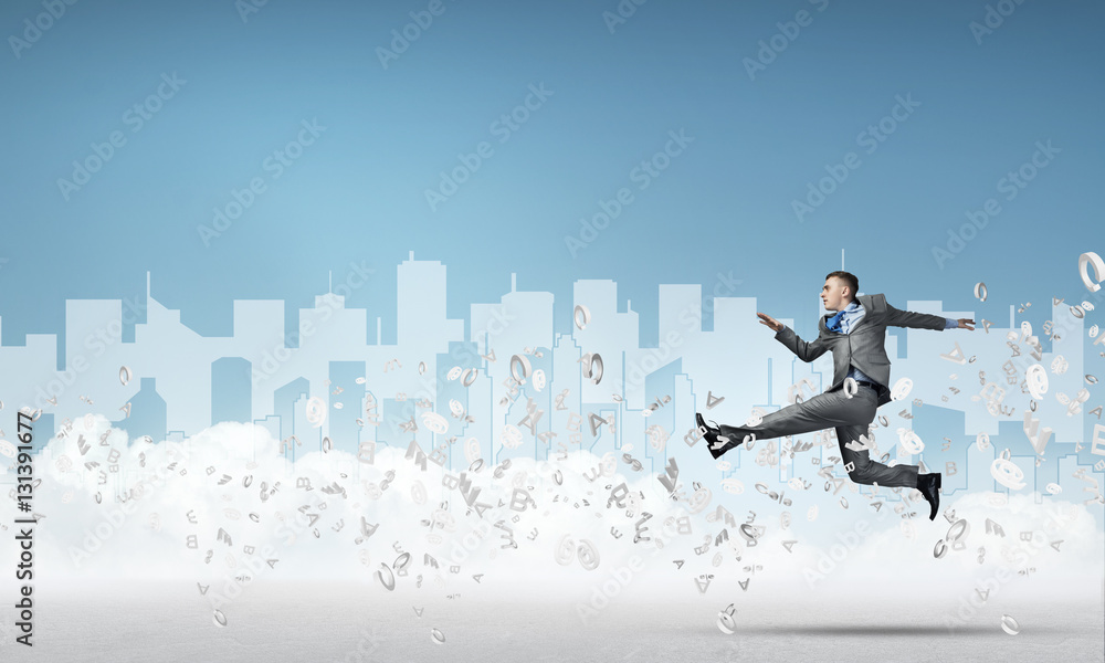 Businessman jumping high