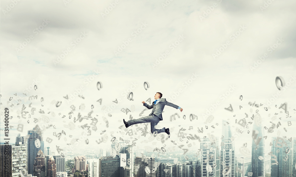 Businessman jumping high