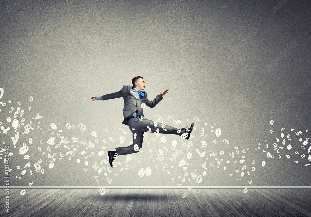 Businessman jumping high