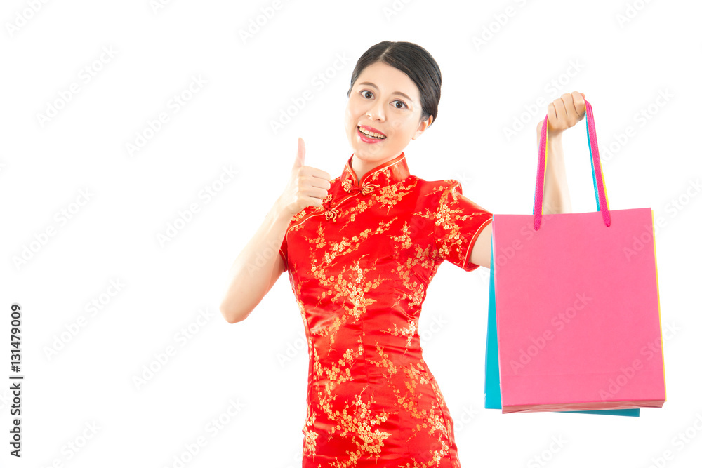 woman hold shopping bag and thumb up