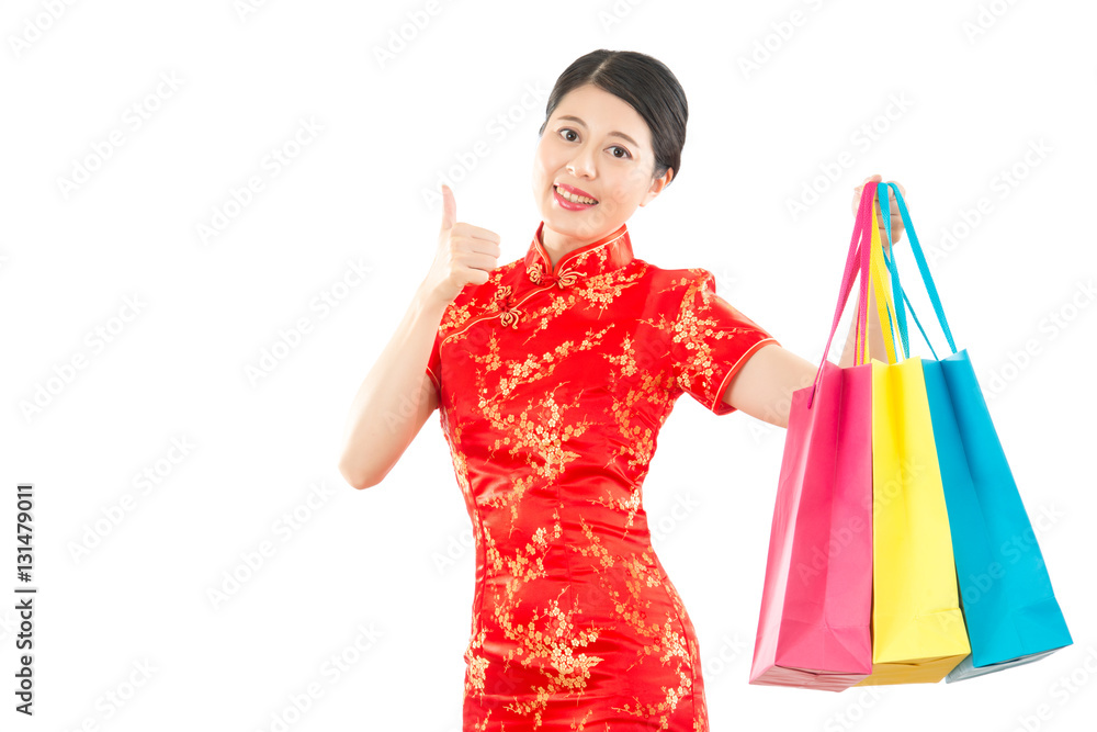 woman thumbs up with colored shopping bags