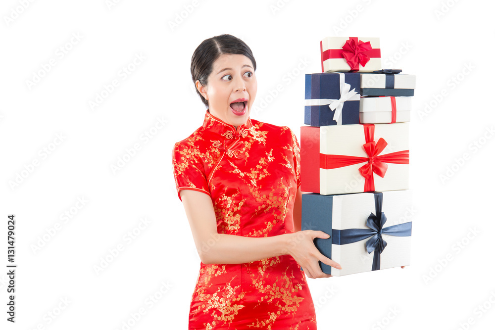 shocked woman holding many gift boxes