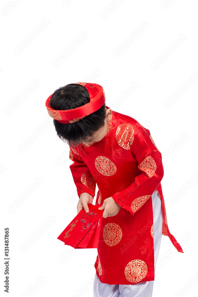 Little Vietnamese boy holding red envelops for Tet. The word mea