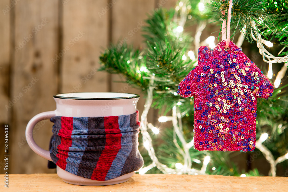 Ginger tea in a cup on wooden background