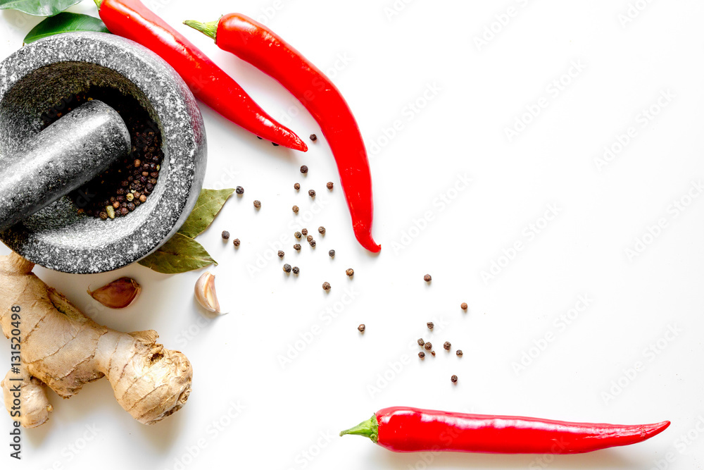 spices and stone mortar white background top view mock up