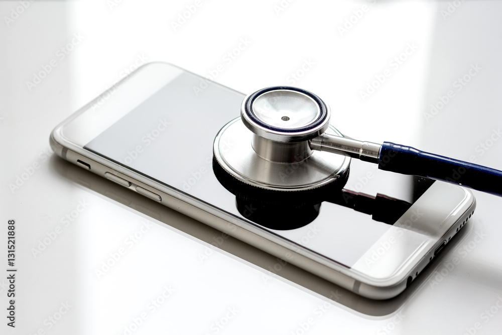 diagnostic of gadgets on white background with stethoscope