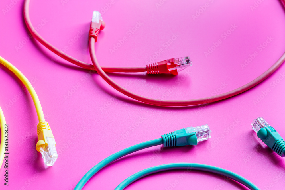 concept network internet cable on pink background close up