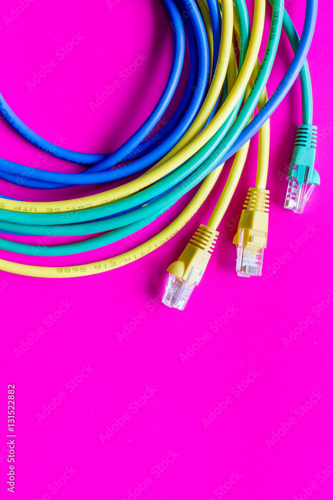 concept network internet cable on pink background close up