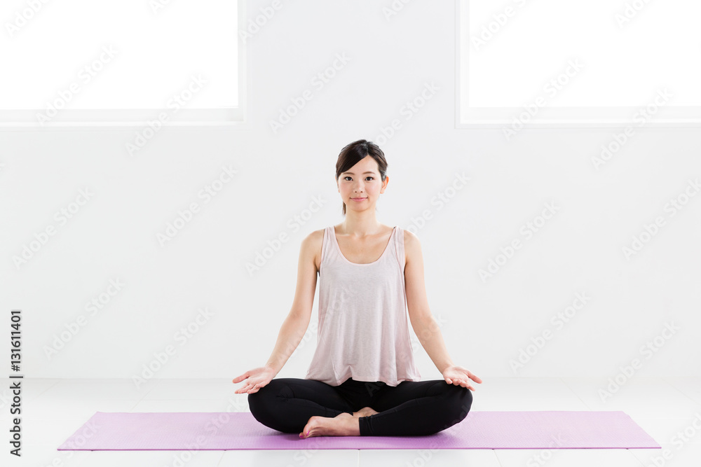 young asian woman exercising in sports gym