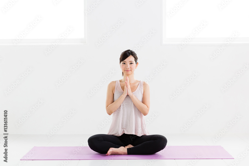 young asian woman exercising in sports gym