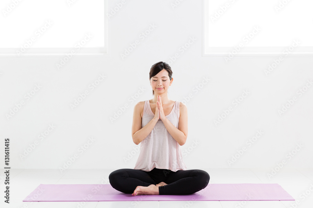 young asian woman exercising in sports gym