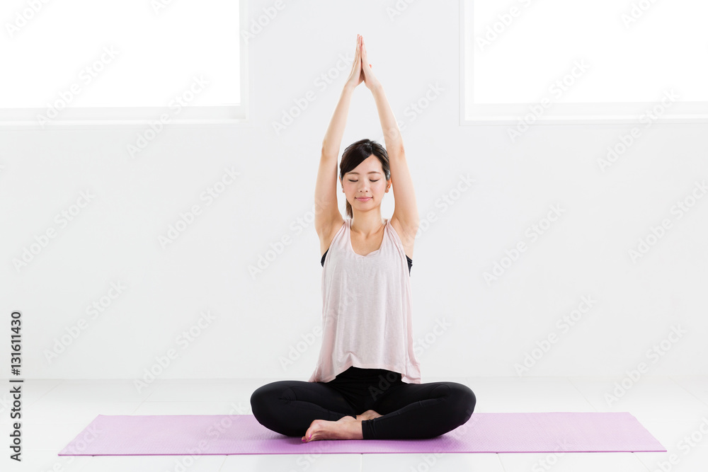 young asian woman exercising in sports gym