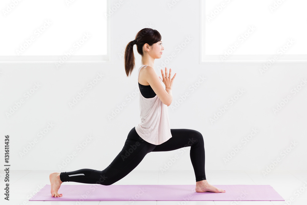 young asian woman exercising in sports gym