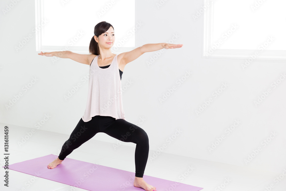 young asian woman exercising in sports gym