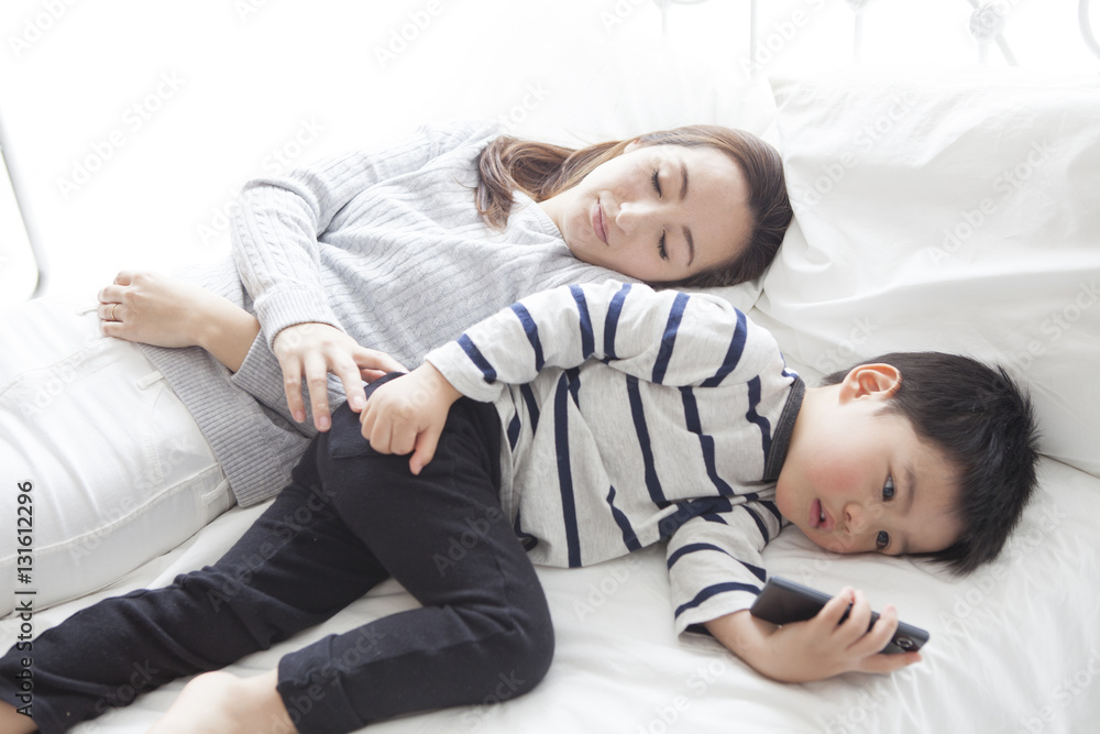 My mother sleeps and my son is watching smartphone