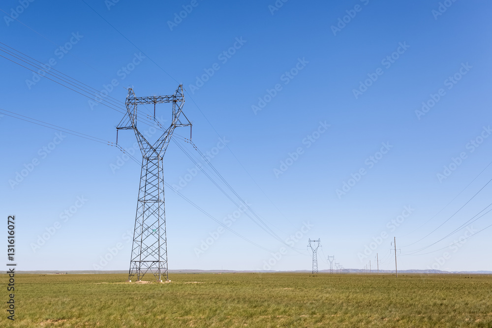 electricity transmission pylon in prairie