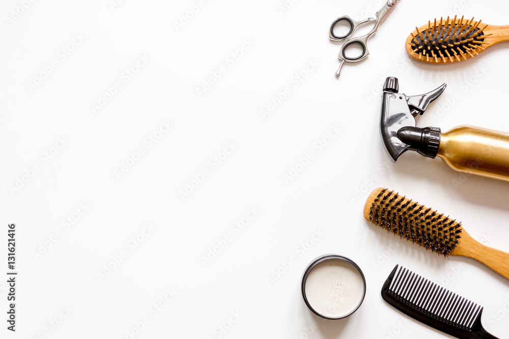 combs and hairdresser tools on white background top view