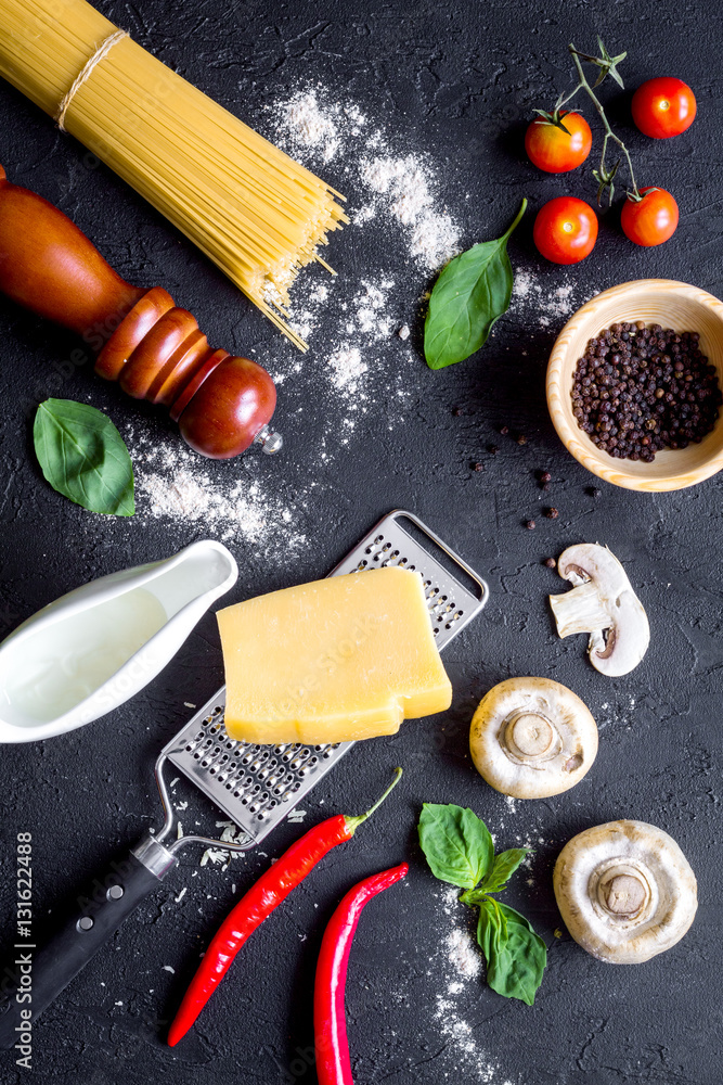 ingredients for cooking paste on dark background top view