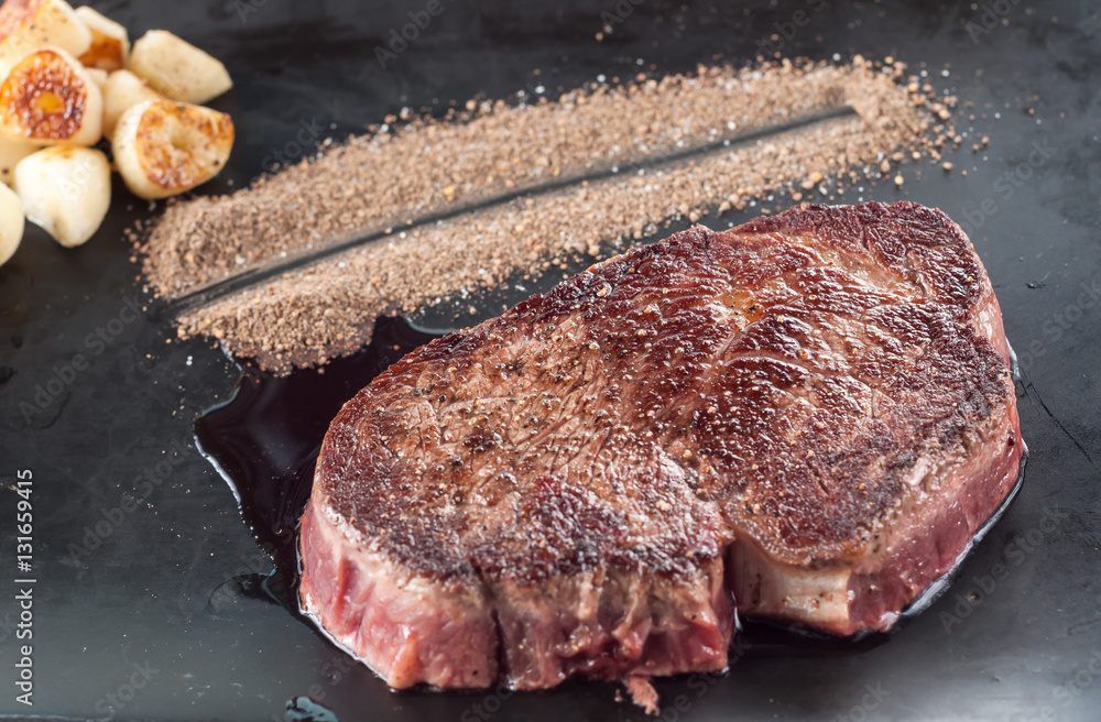 Fried steak with garlic, vegetables