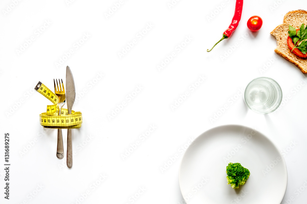 concept slimming diet fresh vegetables on white background top view