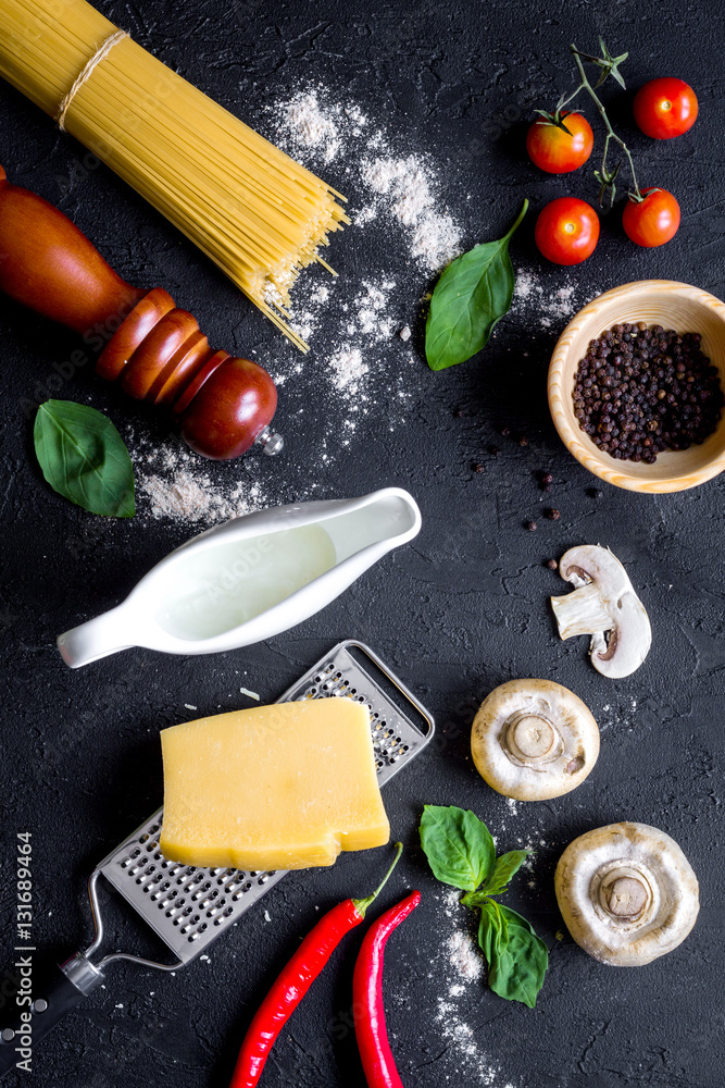 ingredients for cooking paste on dark background top view