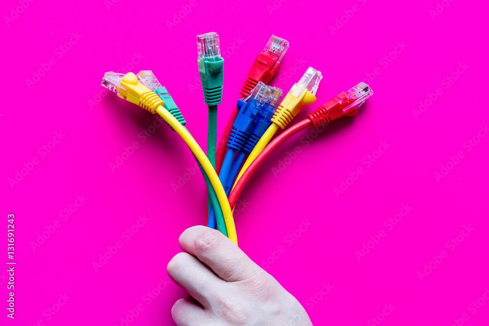 concept network internet cable on pink background close up