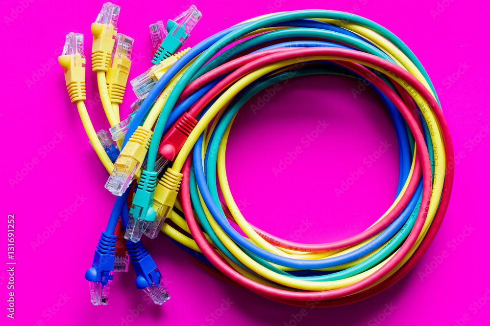 concept network internet cable on pink background close up