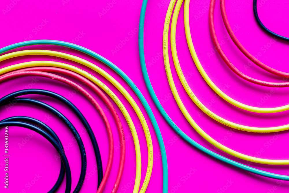 concept network internet cable on pink background close up