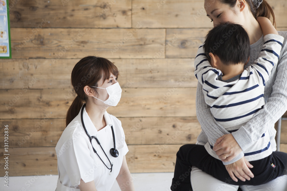 The nurse is talking to parents and children