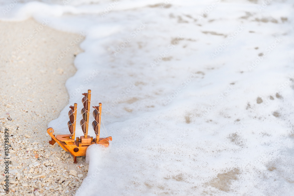 Mini ship on the beach