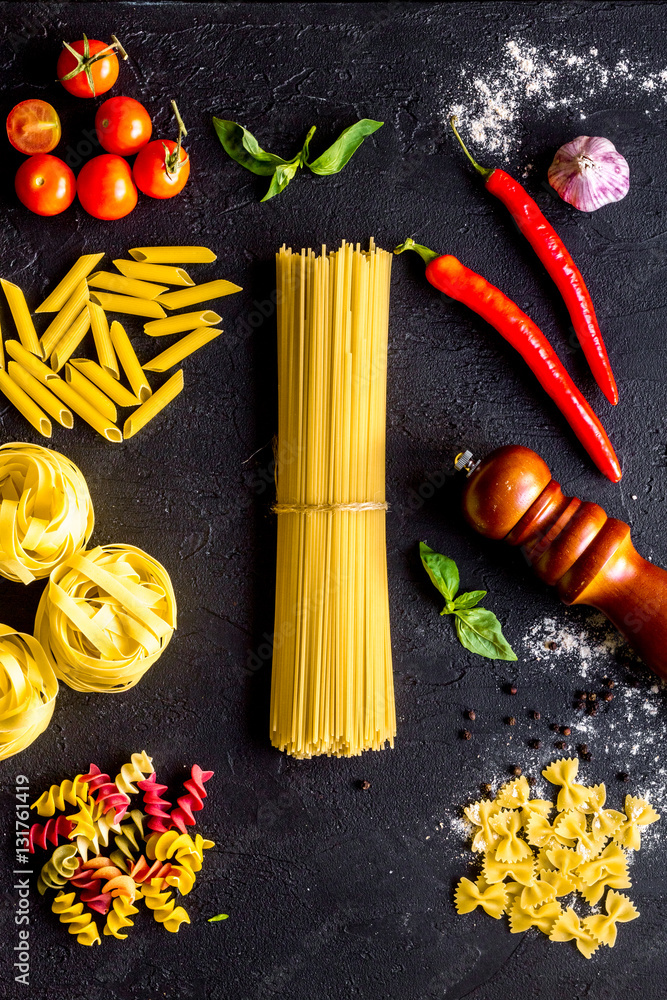 ingredients for cooking paste on dark background top view