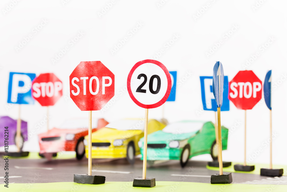 Play set of toy speed-limit and stop road signs