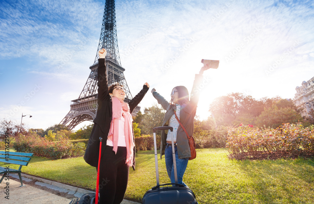 Happy tourist meeting near the Eiffel Tower