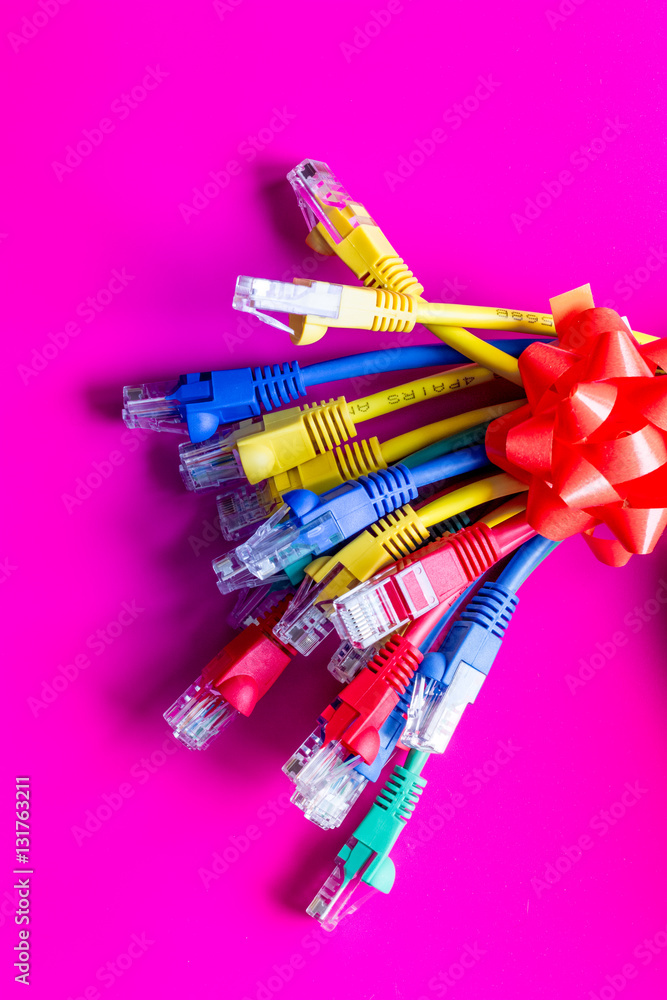 concept network internet cable on pink background close up