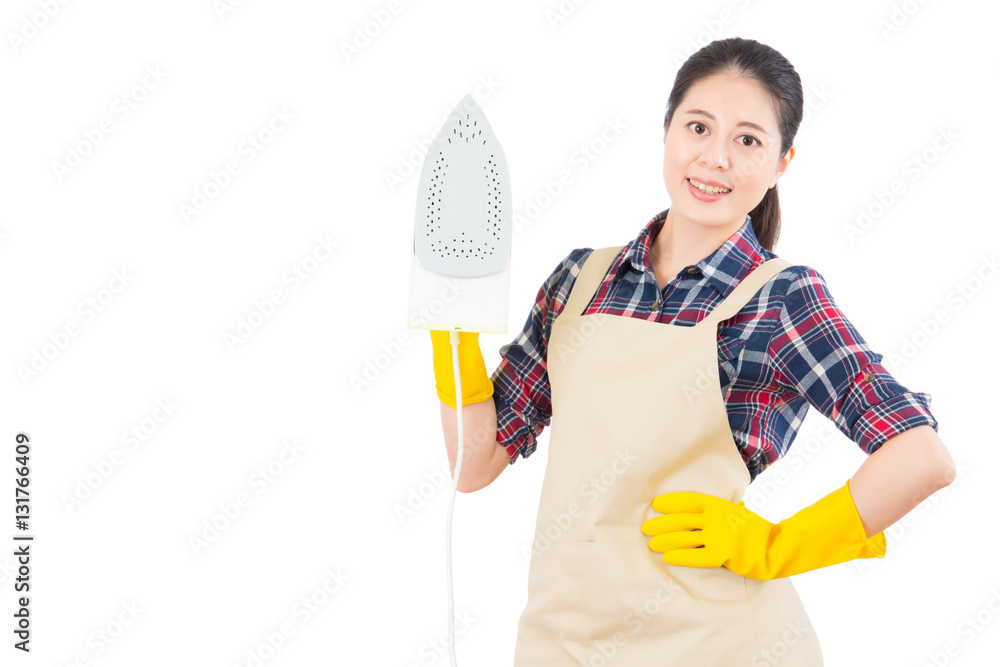 Young smiling woman is ironing