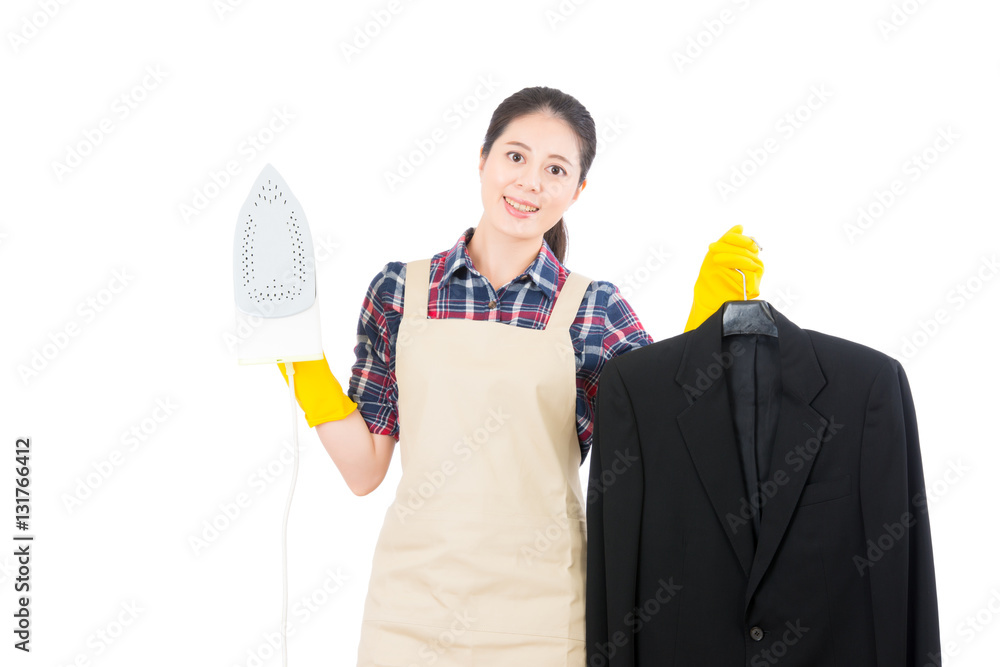 housewife using iron for business suit