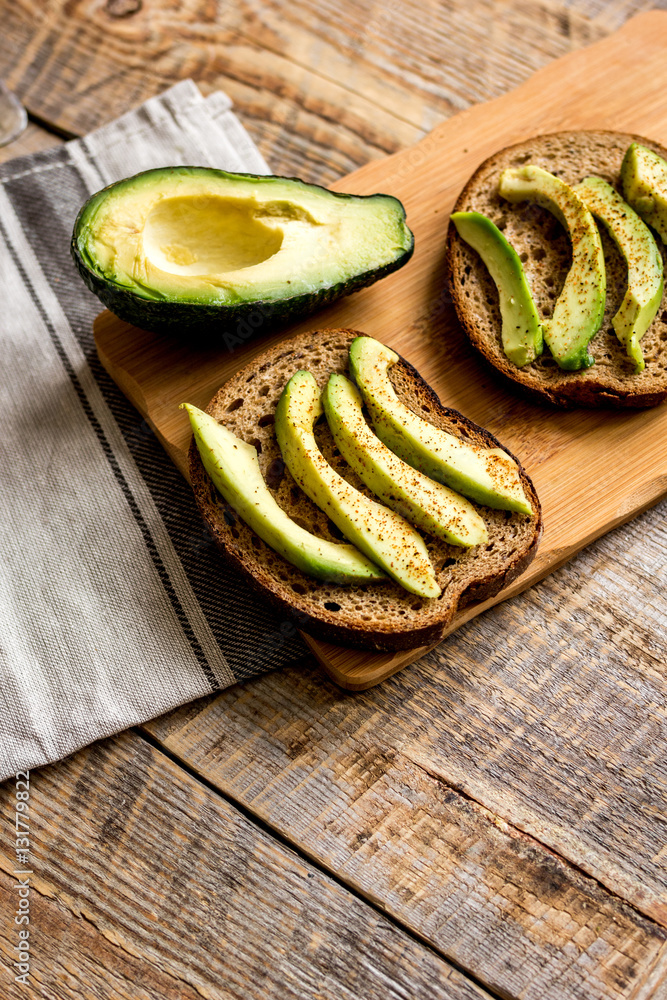 making sandwiches with avocado healthy organic food top view