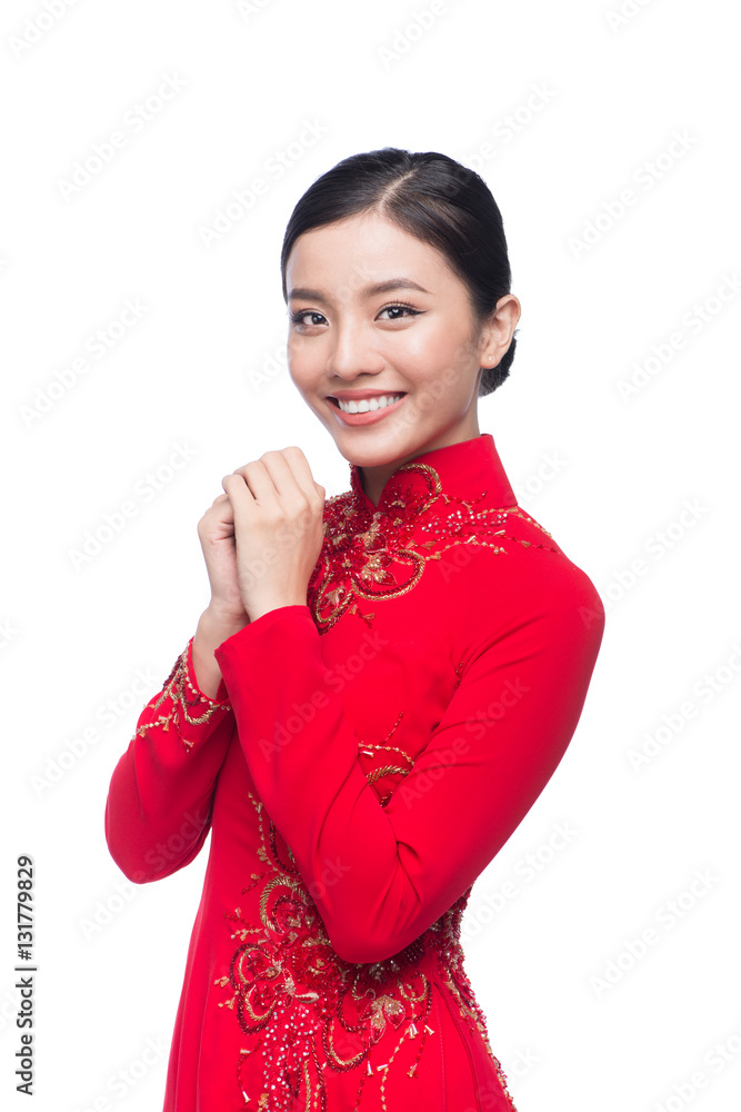 Young vietnamese woman in Ao Dai Dress with praying gesture wish