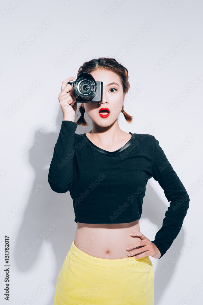 Close up Portrait of beautiful woman with retro hipster camera h